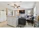 Spacious living room features a sectional sofa and a kitchen island at 918 Windward Way, Palm Harbor, FL 34685