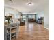 Open concept living and dining area with hardwood floors at 918 Windward Way, Palm Harbor, FL 34685