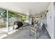 Screened porch with view of backyard and grill at 918 Windward Way, Palm Harbor, FL 34685