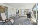 Screened porch with patio furniture and grill at 918 Windward Way, Palm Harbor, FL 34685