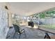 Screened porch with backyard view and patio furniture at 918 Windward Way, Palm Harbor, FL 34685