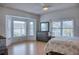 Spacious bedroom has lots of natural light from three large windows and a ceiling fan at 9359 Blind Pass Rd # 205, St Pete Beach, FL 33706