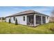 Home exterior showcasing a screened patio and landscaping at 9814 Crescent Moon Dr, Riverview, FL 33578