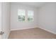 Bright bedroom with neutral carpet and large windows at 10270 Fieldstone Myrtle Way, San Antonio, FL 33576