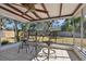 Covered patio with tiled floor, ceiling fan and outdoor seating at 1114 20Th Sw St, Largo, FL 33770