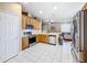 Kitchen features stainless steel appliances and oak cabinets at 12019 Citrus Leaf Dr, Gibsonton, FL 33534