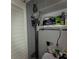 Utility closet with various storage items and pipes at 1365 Snell Isle Ne Blvd # 2B, St Petersburg, FL 33704