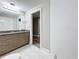 Clean bathroom with a walk-in shower and updated fixtures at 1401 26Th N Ave, St Petersburg, FL 33704