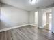 Spacious bedroom with wood-look floors and access to closets at 1401 26Th N Ave, St Petersburg, FL 33704