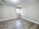 Bright bedroom with wood-look flooring and neutral walls at 1401 26Th N Ave, St Petersburg, FL 33704