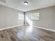 Bright bedroom with wood-look flooring and neutral walls at 1401 26Th N Ave, St Petersburg, FL 33704
