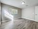 Spacious bedroom with wood-look floors and a window at 1401 26Th N Ave, St Petersburg, FL 33704