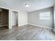 Bright bedroom with wood-look flooring and neutral walls at 1401 26Th N Ave, St Petersburg, FL 33704