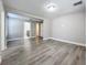 Spacious bedroom with wood-look floors and access to bathroom at 1401 26Th N Ave, St Petersburg, FL 33704