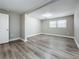 Bright bedroom with wood-look floors and two windows at 1401 26Th N Ave, St Petersburg, FL 33704