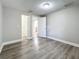 Spacious bedroom with wood-look floors and access to closets at 1401 26Th N Ave, St Petersburg, FL 33704