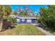 Cute bungalow with a freshly painted exterior and landscaping at 1401 26Th N Ave, St Petersburg, FL 33704