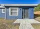 Modern dark gray front door and walkway at 1401 26Th N Ave, St Petersburg, FL 33704