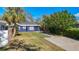 Newly renovated home with a charming front yard and walkway at 1401 26Th N Ave, St Petersburg, FL 33704