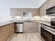 Modern kitchen with stainless steel appliances and granite countertops at 1401 26Th N Ave, St Petersburg, FL 33704