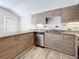 Updated kitchen featuring granite countertops and wood cabinets at 1401 26Th N Ave, St Petersburg, FL 33704