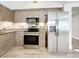 Modern kitchen with stainless steel appliances and granite countertops at 1401 26Th N Ave, St Petersburg, FL 33704