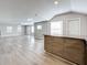 Open concept living area with light wood flooring at 1401 26Th N Ave, St Petersburg, FL 33704