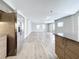 Open living room with light wood flooring and ceiling fan at 1401 26Th N Ave, St Petersburg, FL 33704