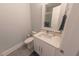 Clean bathroom with white vanity, quartz countertop, and toilet at 152 Brightwater Dr # 4, Clearwater Beach, FL 33767