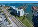 Aerial view of waterfront condo building with pool and boat slips at 1591 Gulf Blvd # 504S, Clearwater Beach, FL 33767