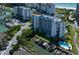 Aerial view showing building, boat slips, and pool at 1591 Gulf Blvd # 504S, Clearwater Beach, FL 33767