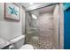 Bathroom with walk-in shower and pebble floor at 1591 Gulf Blvd # 504S, Clearwater Beach, FL 33767