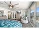 Main bedroom with water view, walk-in closet, and ceiling fan at 1591 Gulf Blvd # 504S, Clearwater Beach, FL 33767