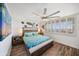 Bedroom with water view and ceiling fan at 1591 Gulf Blvd # 504S, Clearwater Beach, FL 33767