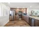 Modern kitchen with stainless steel appliances and granite countertops at 1591 Gulf Blvd # 504S, Clearwater Beach, FL 33767