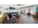 Living room with comfortable sectional sofa and access to balcony at 1591 Gulf Blvd # 504S, Clearwater Beach, FL 33767