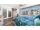 Spacious main bedroom with a king-size bed and dresser at 1591 Gulf Blvd # 504S, Clearwater Beach, FL 33767