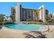 Small community pool with surrounding patio at 1591 Gulf Blvd # 504S, Clearwater Beach, FL 33767