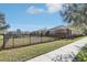 Side yard with a fence and playground at 16020 Starling Crossing Dr, Lithia, FL 33547
