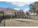 Spacious backyard featuring a screened patio and lush lawn at 16020 Starling Crossing Dr, Lithia, FL 33547