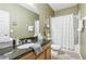 Bathroom with granite countertop and white shower/tub at 16020 Starling Crossing Dr, Lithia, FL 33547