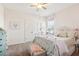 Charming bedroom with a white metal bed frame and soft decor at 16020 Starling Crossing Dr, Lithia, FL 33547