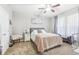 Primary bedroom with a queen bed and neutral decor at 16020 Starling Crossing Dr, Lithia, FL 33547