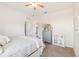 Bedroom with white metal bed frame and soft, floral decor at 16020 Starling Crossing Dr, Lithia, FL 33547