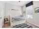 Bright bedroom featuring a daybed, window, and closet at 16020 Starling Crossing Dr, Lithia, FL 33547