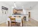 Charming dining area with a table for four and a view into the kitchen at 16020 Starling Crossing Dr, Lithia, FL 33547