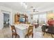 Open concept dining area with adjacent living room and view into bedroom at 16020 Starling Crossing Dr, Lithia, FL 33547