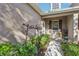 Inviting front entry with a welcoming sign and landscaping at 16020 Starling Crossing Dr, Lithia, FL 33547
