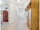 Bright hallway with tile flooring and wooden cabinet at 16020 Starling Crossing Dr, Lithia, FL 33547
