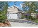 Two-story house with a two-car garage at 16020 Starling Crossing Dr, Lithia, FL 33547